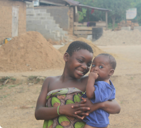 Image of a girl carrying a little boy